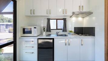 Standard Cabin (Sleeps 4) | Private kitchenette | Fridge, microwave, stovetop, toaster