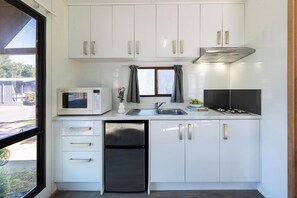 Standard Cabin (Sleeps 4) | Private kitchenette | Shared fridge, microwave, stovetop, toaster