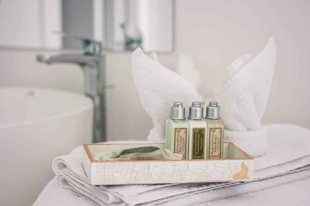Shower, rainfall showerhead, hair dryer, towels