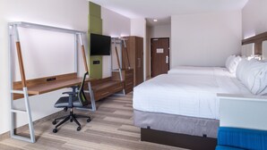 A hotel room with a bed, a desk with a chair, a TV mounted on the wall, and a wardrobe. - Holiday Inn Express & Suites Fort Worth West by IHG (Fort Worth)