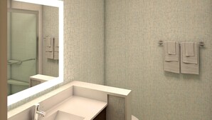 A bathroom with a large mirror, a sink, and a toilet. - Holiday Inn Express & Suites Fort Worth West by IHG (Fort Worth)