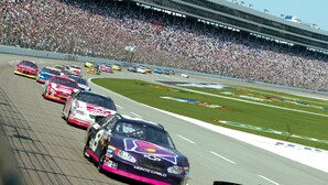A racing event with multiple cars on a track, surrounded by a large crowd. - Holiday Inn Express & Suites Fort Worth West by IHG (Fort Worth)