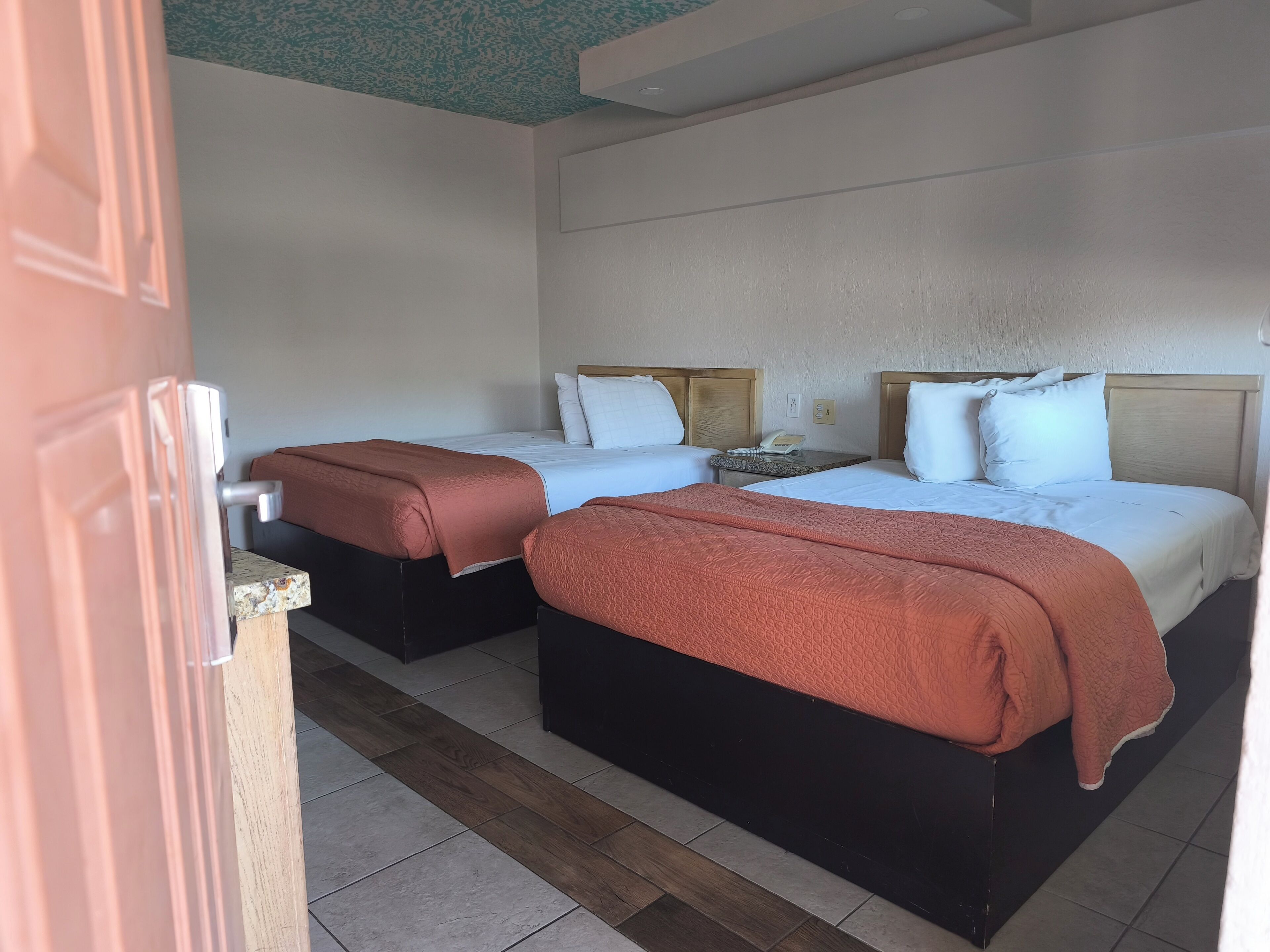 Economy Double Room, Non Smoking | Minibar, in-room safe, iron/ironing board, bed sheets