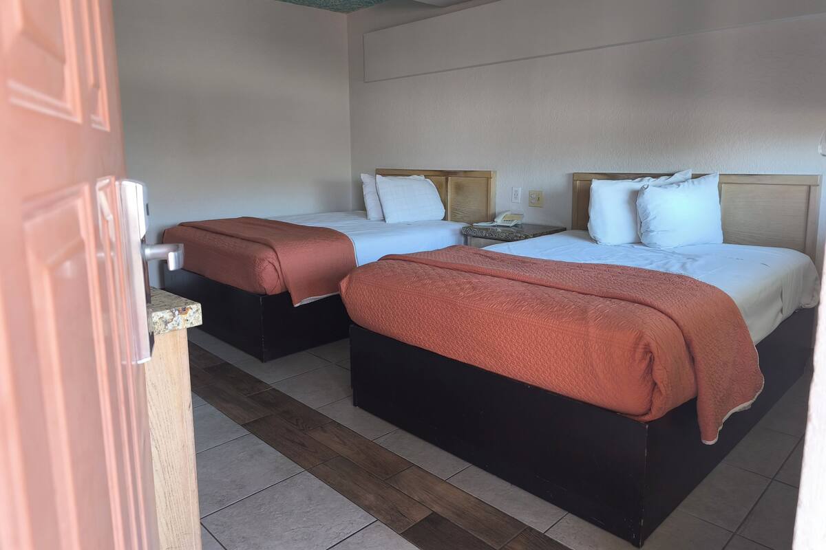 Economy Double Room, Non Smoking | Minibar, in-room safe, iron/ironing board, bed sheets