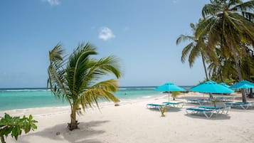 On the beach, white sand, beach towels