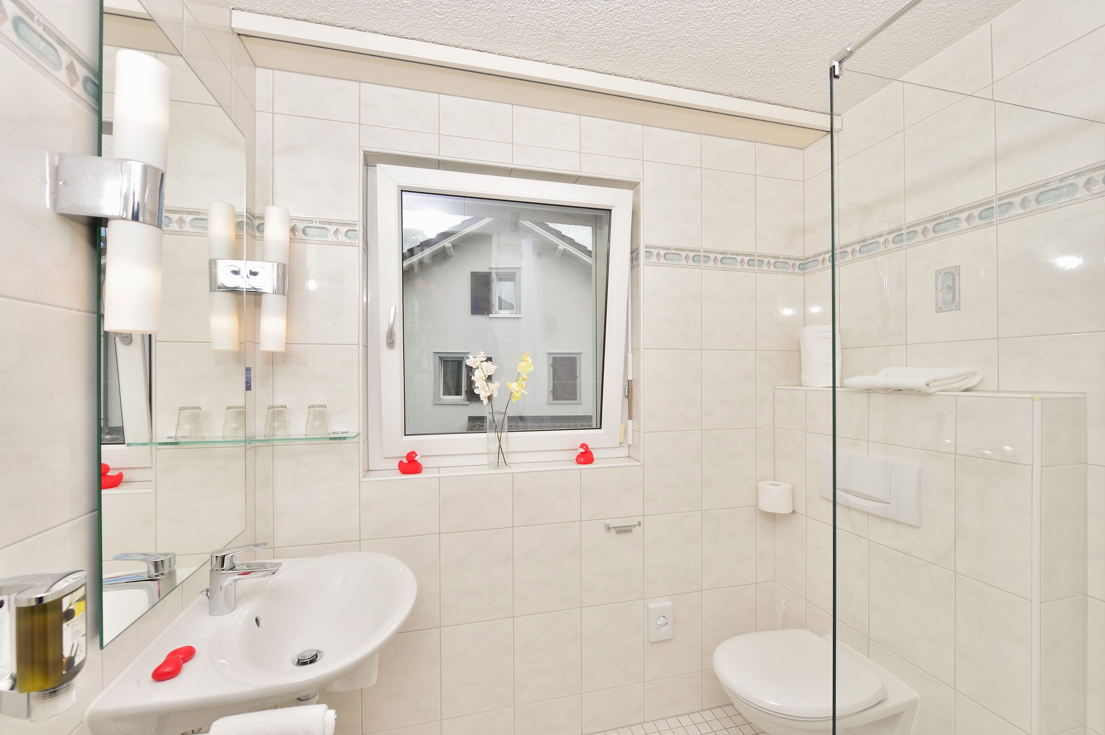 deluxe apartment | bathroom | shower, hair dryer, towels