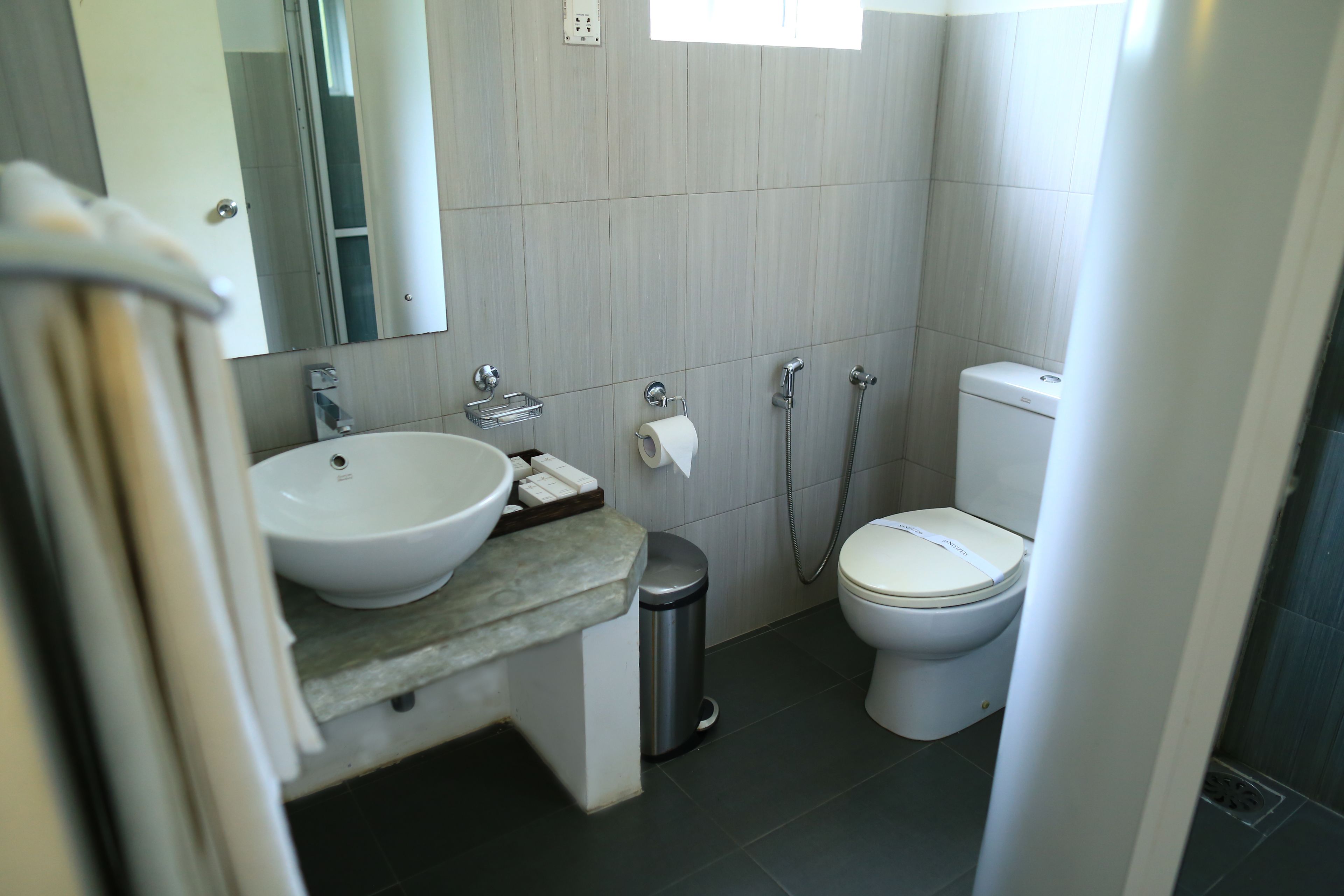economy room | bathroom | shower, free toiletries, hair dryer, bathrobes