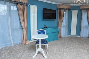 Junior Suite, City View | Premium bedding, minibar, in-room safe, individually decorated