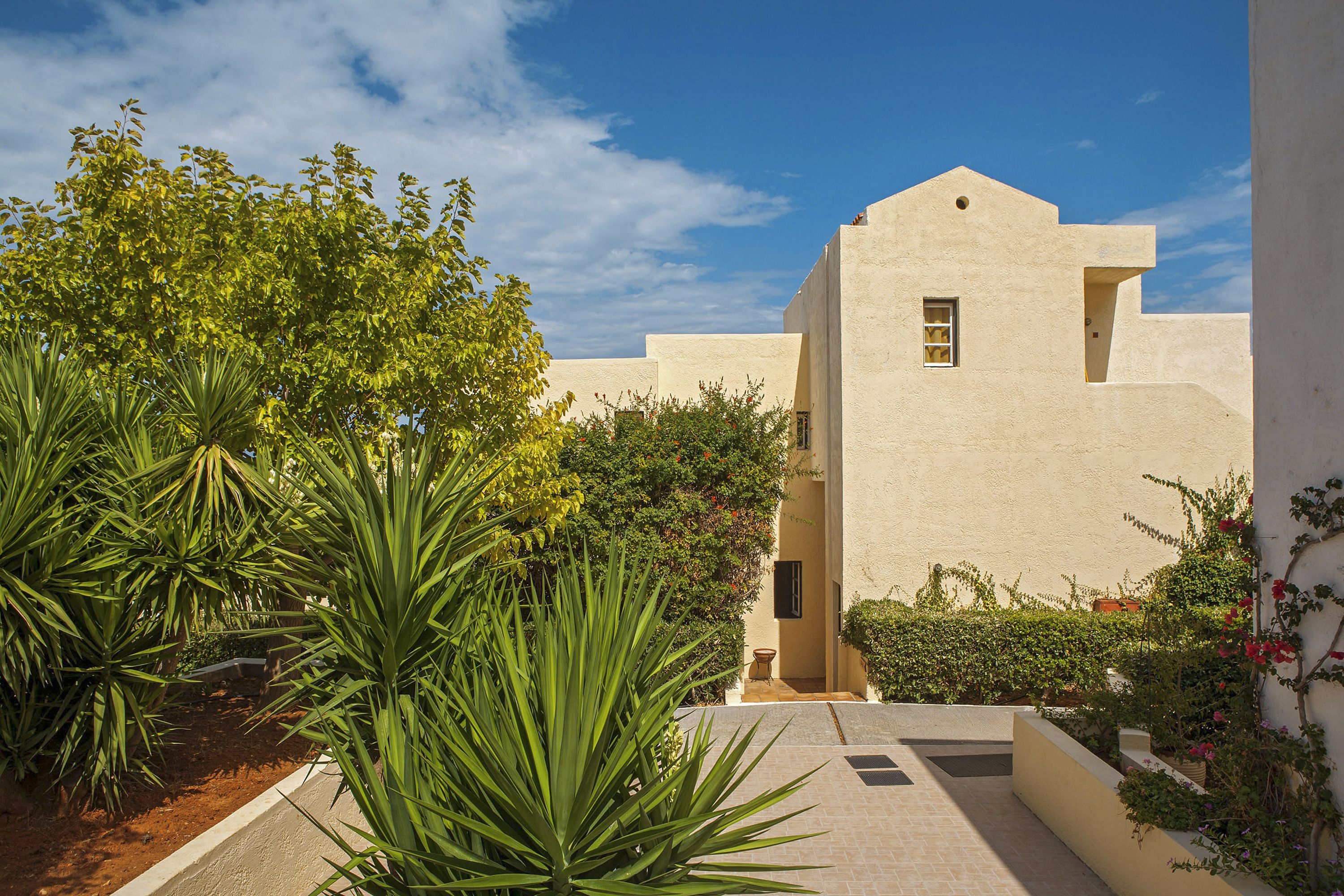 A building with a flat roof and a small window.