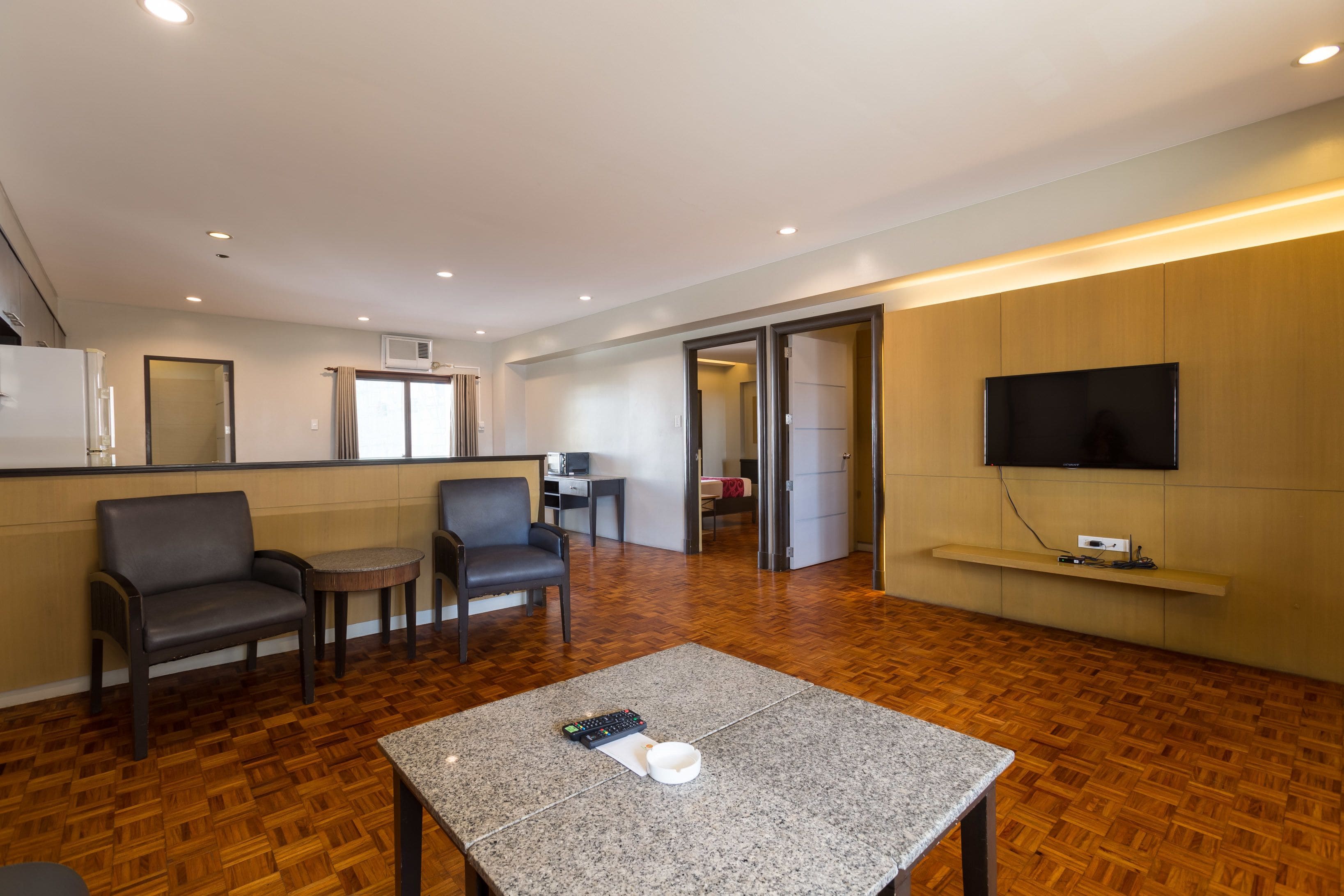 two bedroom premiere suite | living area | flat-screen tv