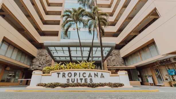 A hotel entrance with a sign reading "TROPICANA SUITES". - Tropicana Suites (Manila)