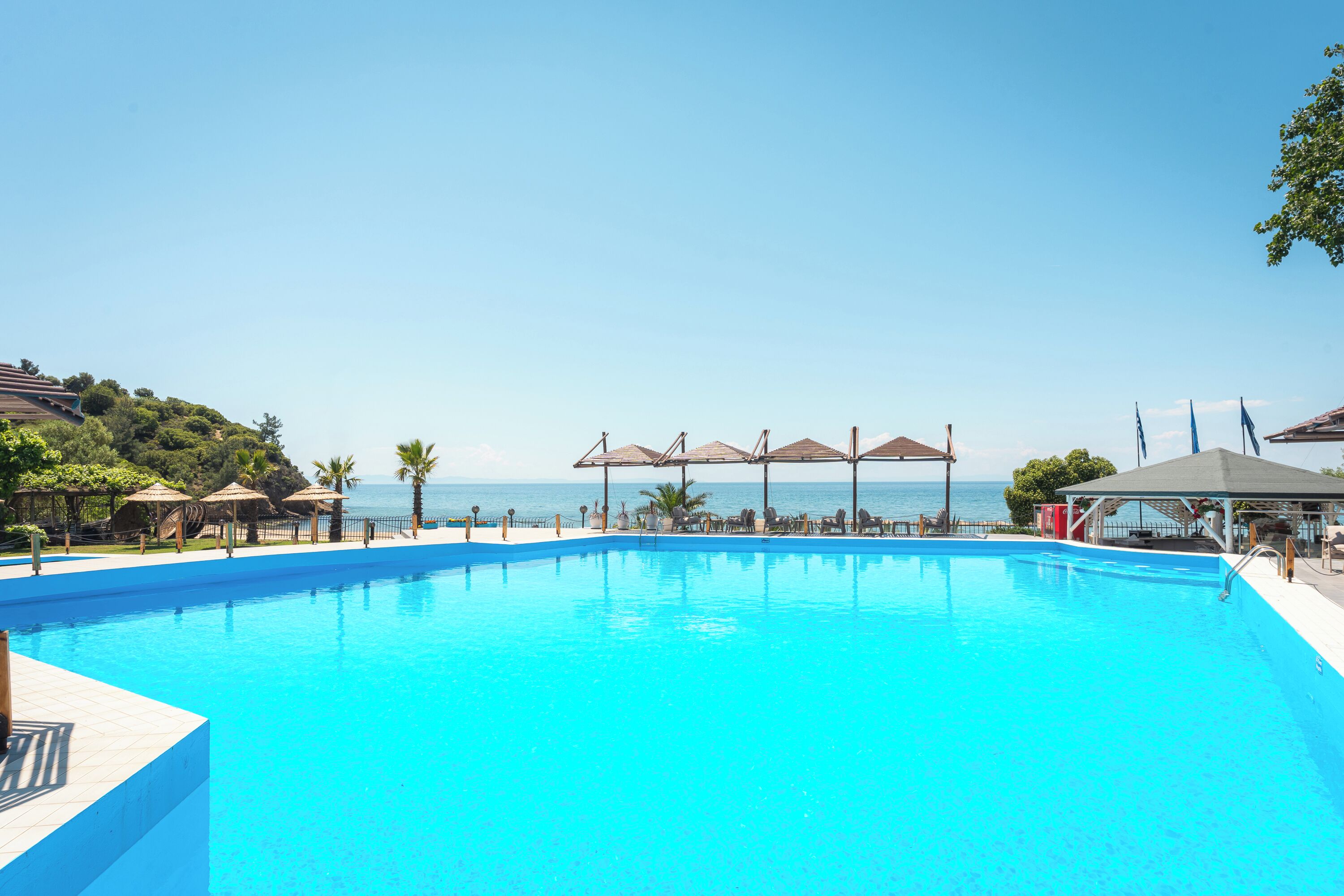 Seasonal outdoor pool, pool umbrellas, pool loungers
