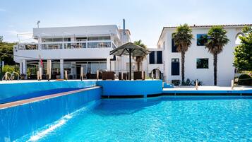 2 outdoor pools, pool umbrellas, pool loungers