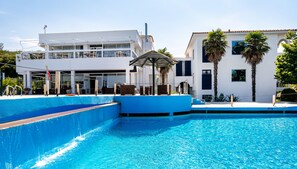 2 outdoor pools, pool umbrellas, pool loungers