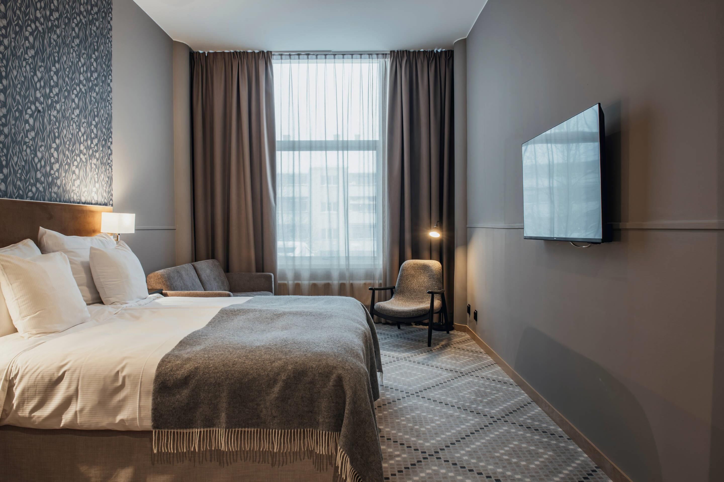 Deluxe Room, Non Smoking | Desk, laptop workspace, blackout drapes, iron/ironing board