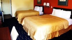 A hotel room with two beds, a desk, and a chair. - Country Inn Sterling (Sterling)