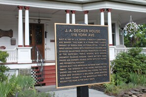 A historical house sign with detailed information about J.A. Decker House at 118 York Ave. - Victorian Charm Inn (Towanda)