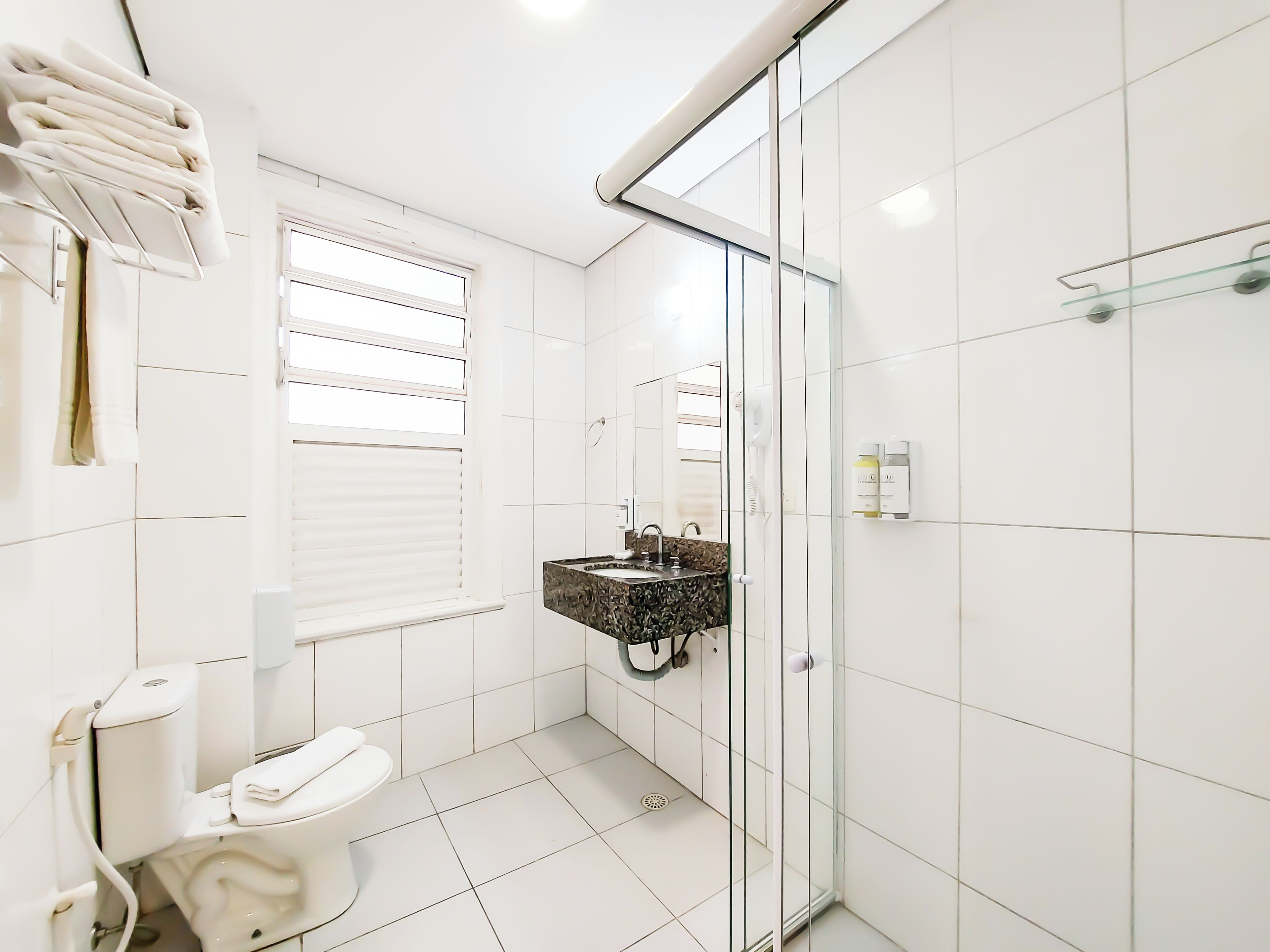superior triple room | bathroom | shower, hair dryer, towels, soap