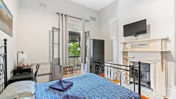 Habitación cuádruple económica, 1 habitación | Caja de seguridad en la habitación, wifi gratis y ropa de cama