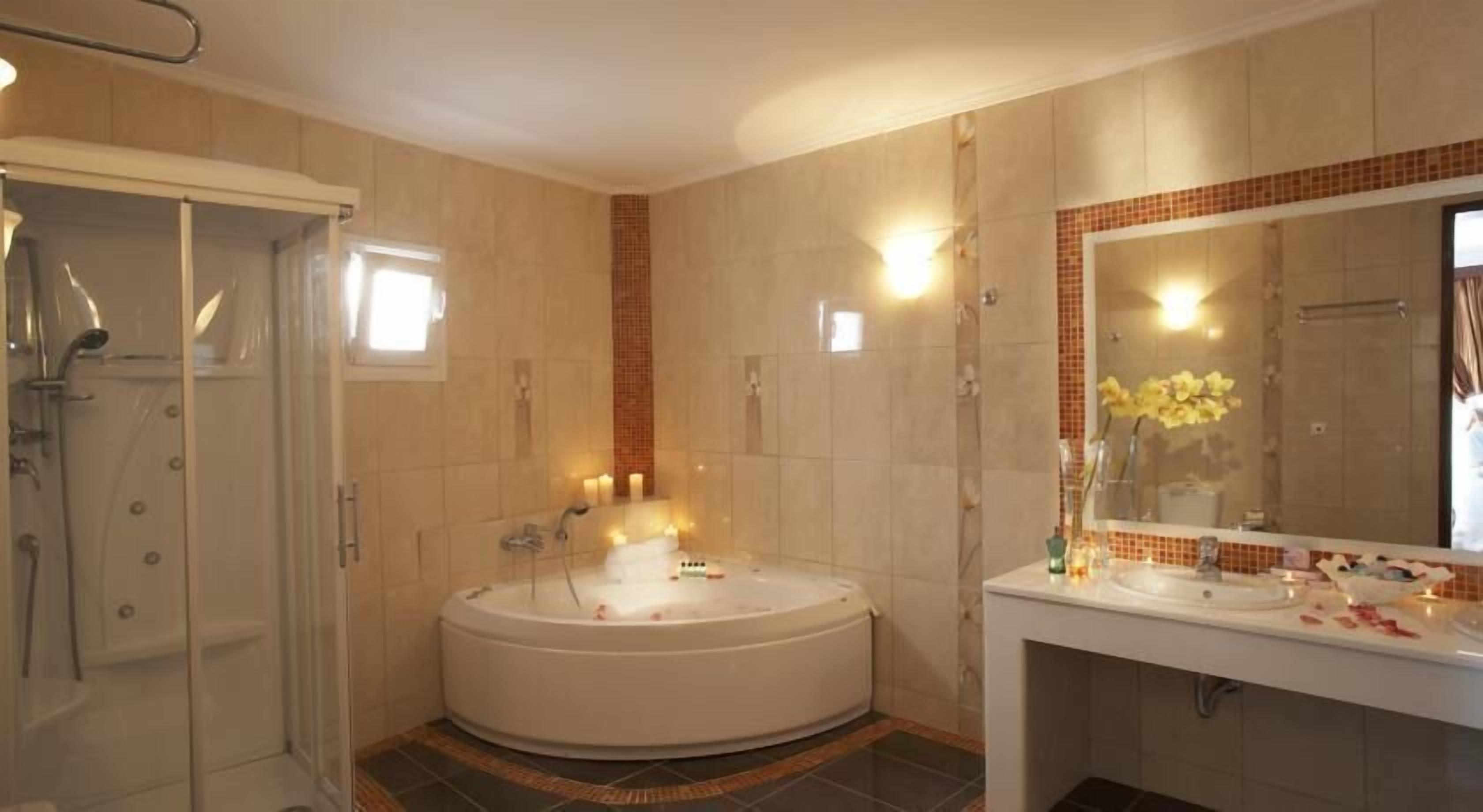 grand suite, private pool | bathroom | hair dryer, towels, soap, shampoo