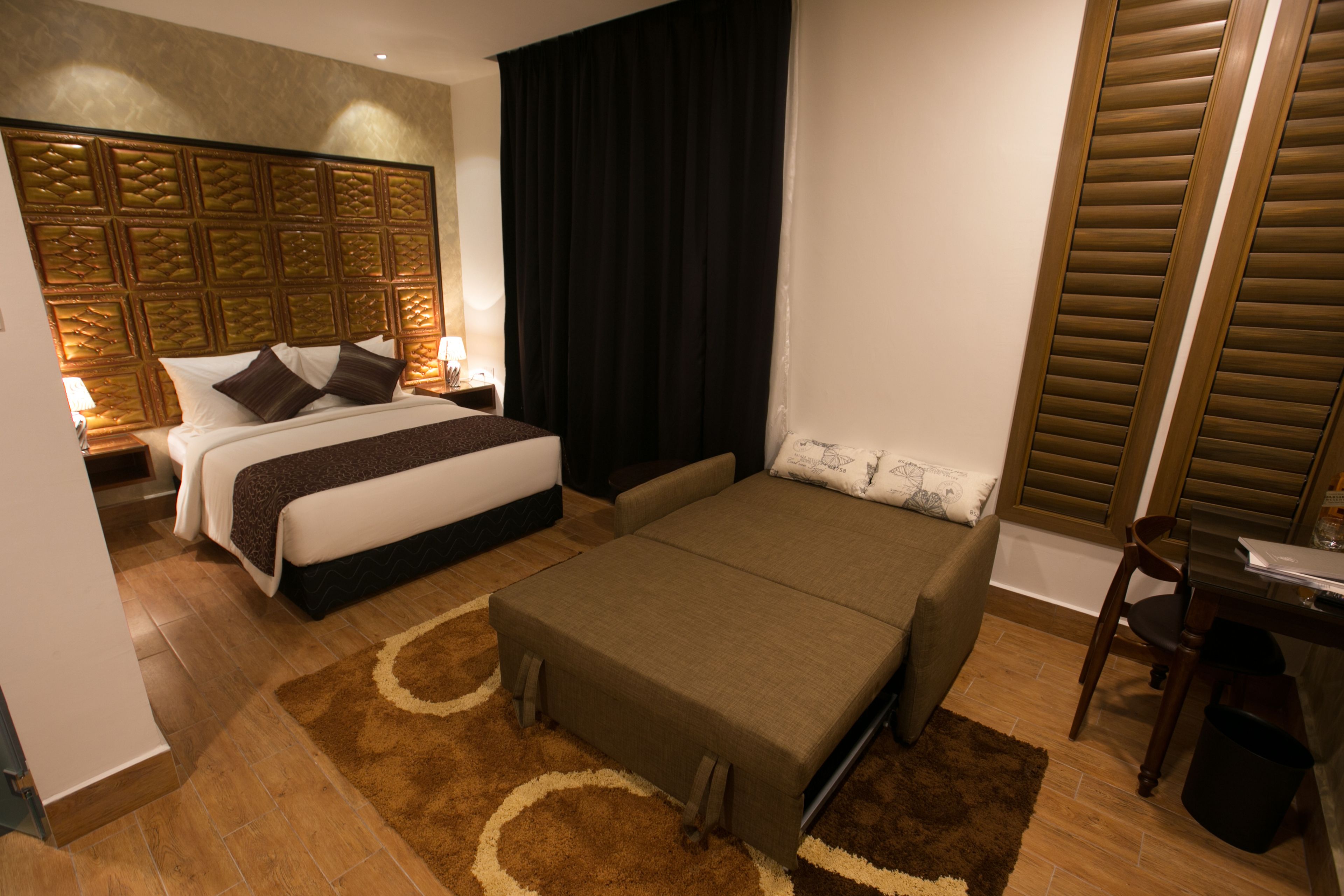 suite | in-room safe, desk, blackout curtains, iron/ironing board