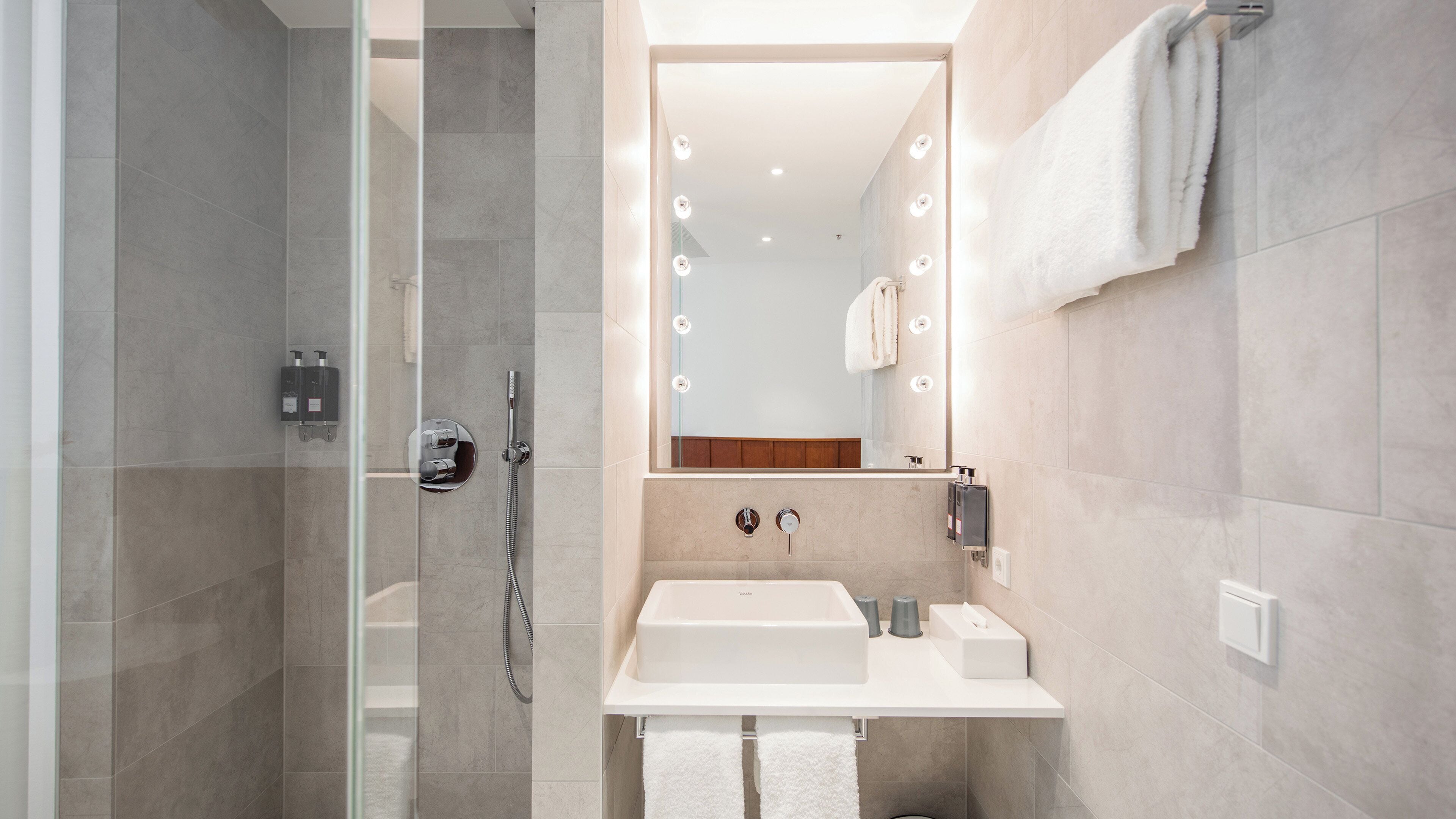 Shower, rainfall showerhead, designer toiletries, hair dryer