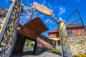 A hotel entrance with a large sign reading "Gardarland Adventure Hotel." - Gardaland Adventure Hotel (Castelnuovo del Garda)