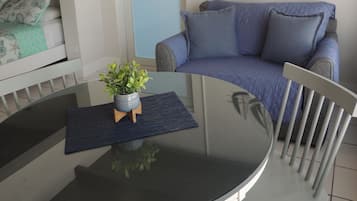 Standard Room, 2 Queen Beds, Refrigerator & Microwave | Living area | 20-inch flat-screen TV with cable channels, TV