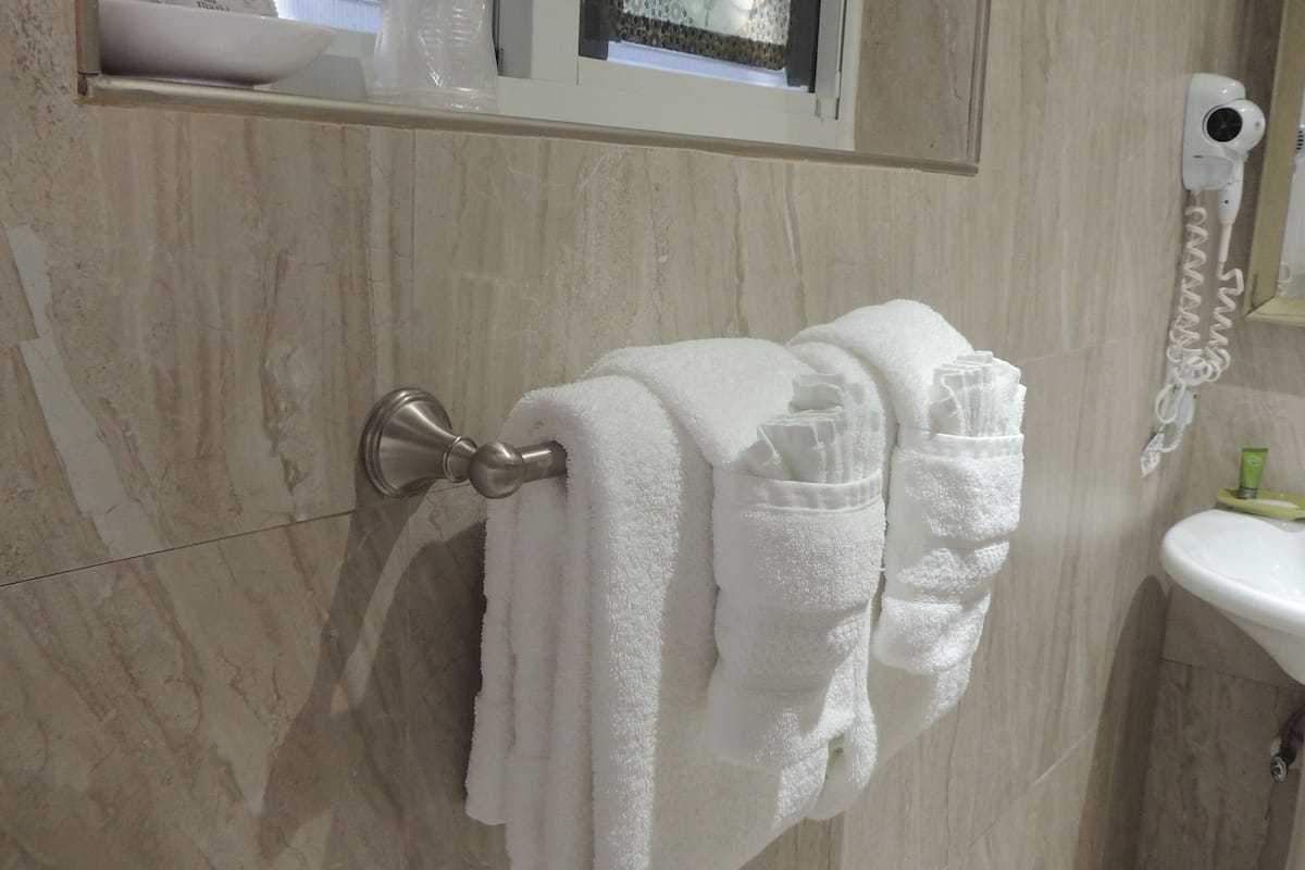 standard room, 2 queen beds, refrigerator & microwave | bathroom | combined shower/bathtub, free toiletries, hair dryer, bathrobes