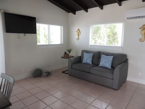 Suite, 1 King Bed with Sofa bed, Kitchenette, Oceanfront | Living area | 20-inch flat-screen TV with cable channels, TV - Sands of Islamorada (Islamorada)