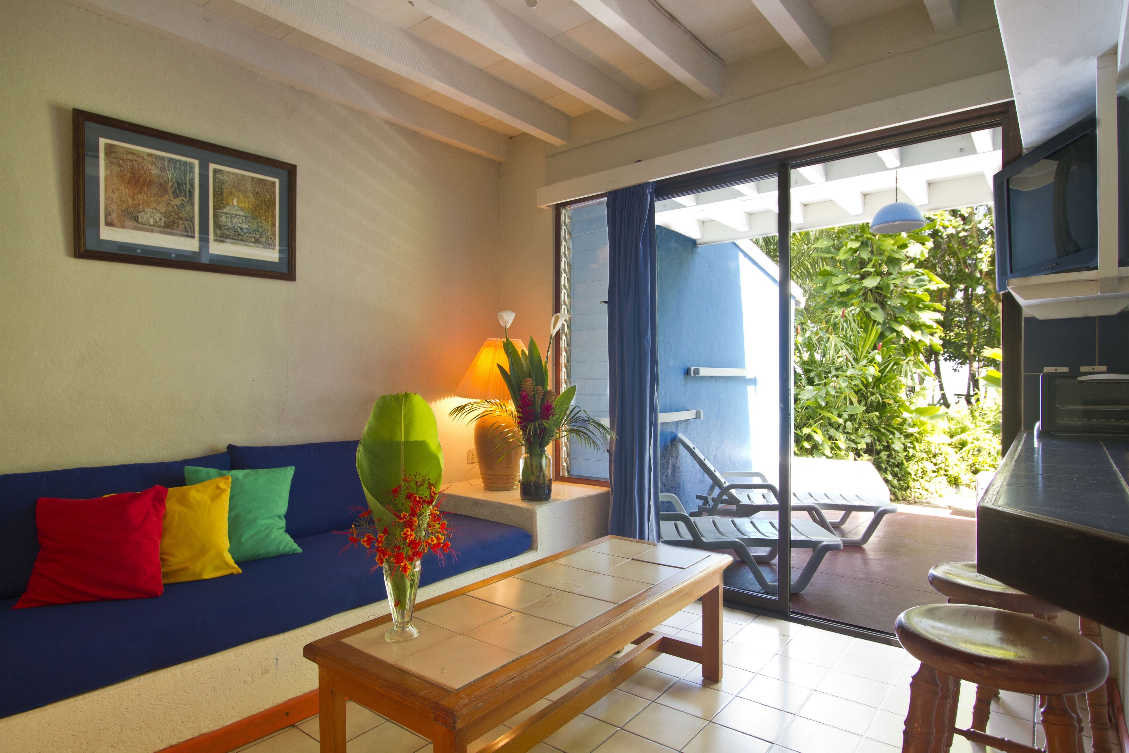 family villa, 2 bedrooms, kitchen, partial ocean view | living area | flat-screen tv