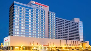 A large, multi-story Hilton Garden Inn hotel with a prominent sign at the top. - Hilton Garden Inn Tanger City Center (Tangier)