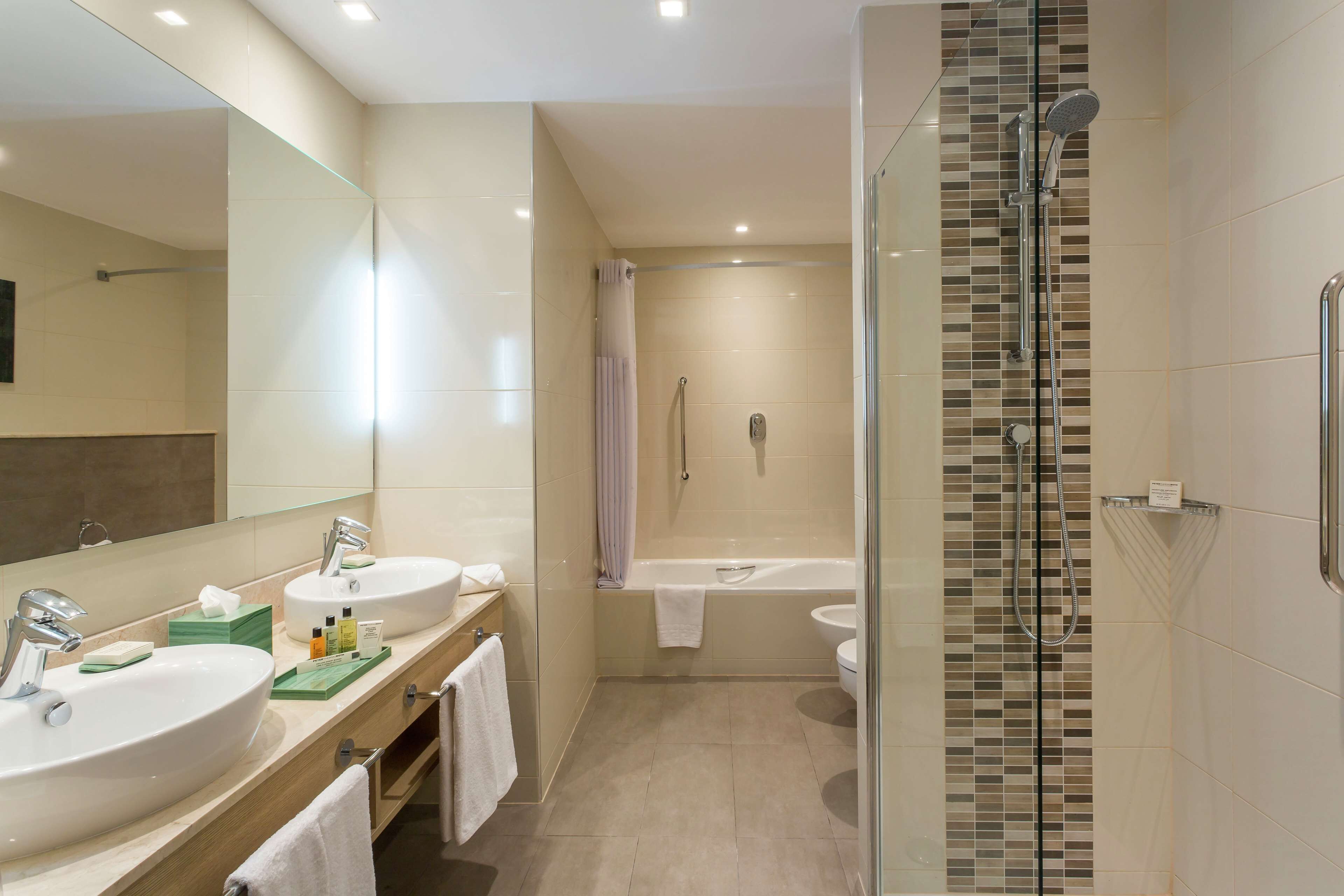 designer toiletries, slippers, bidet, towels