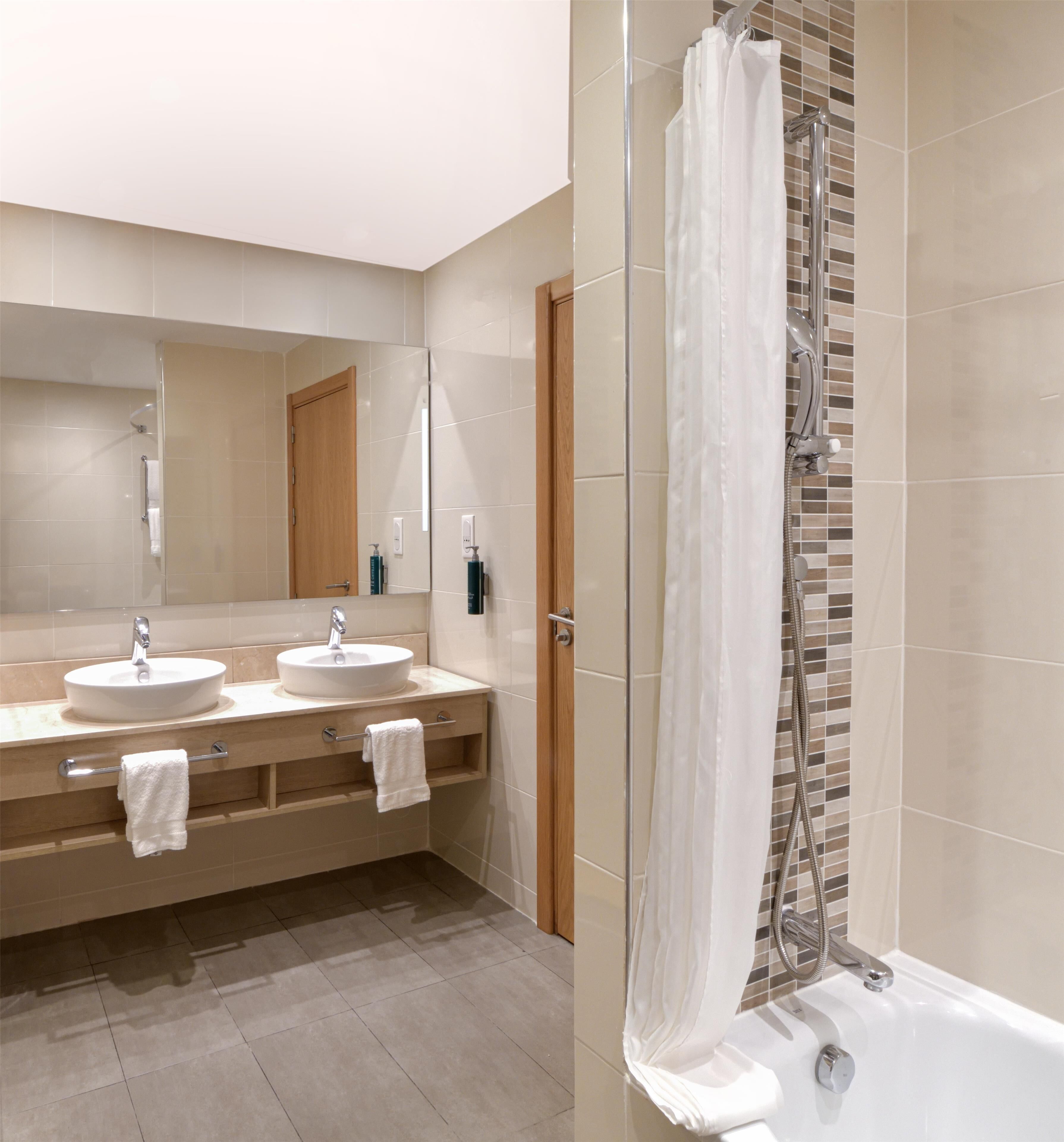 family room, 1 queen bed | bathroom | designer toiletries, slippers, bidet, towels