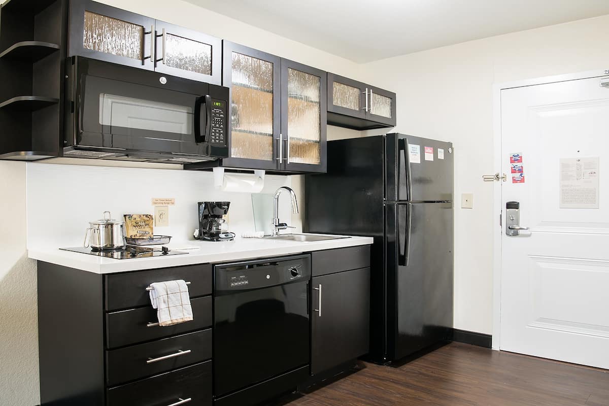 full-sized fridge, microwave, stovetop, dishwasher