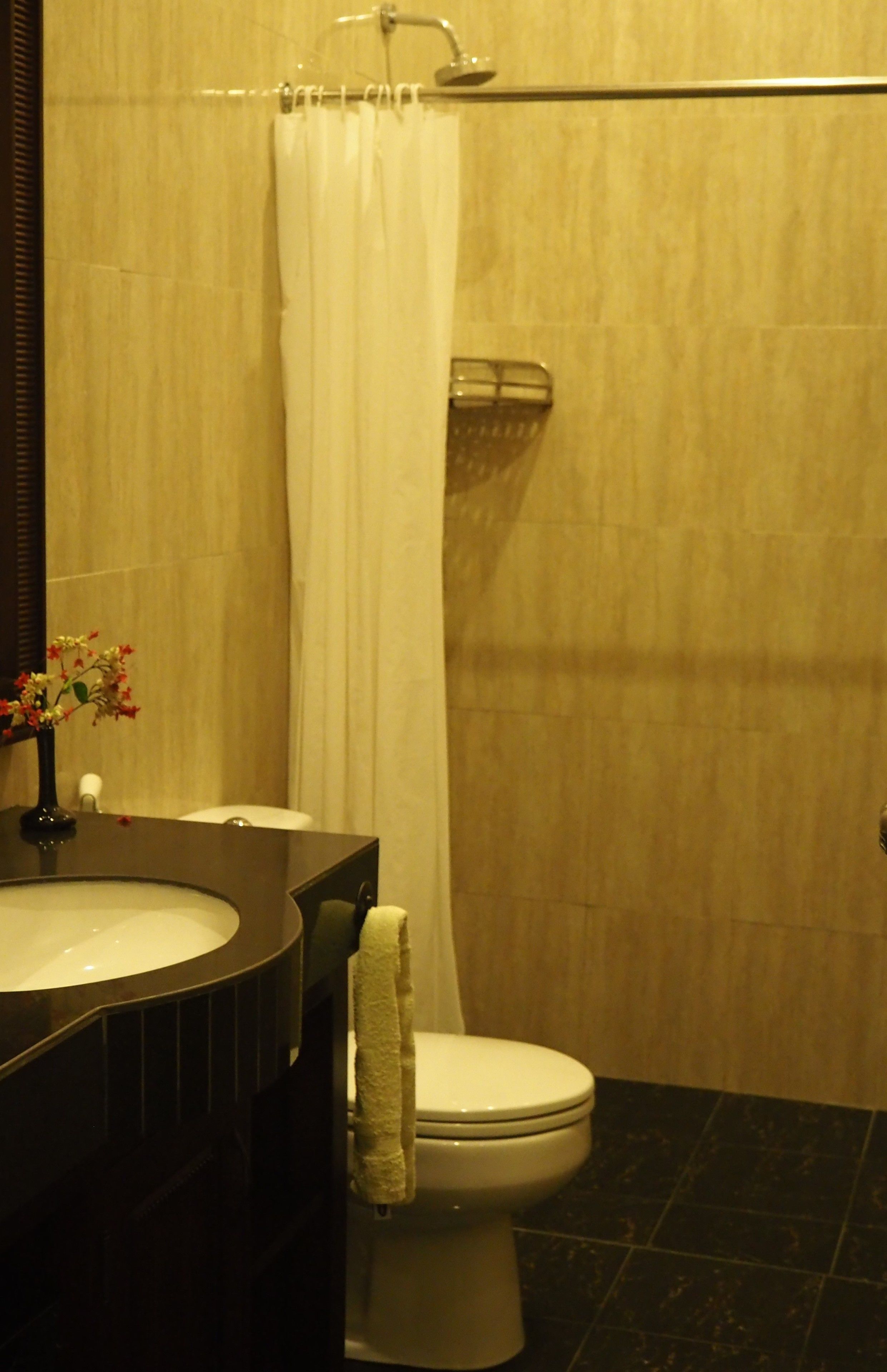 A bathroom with a bathtub, toilet, and sink.