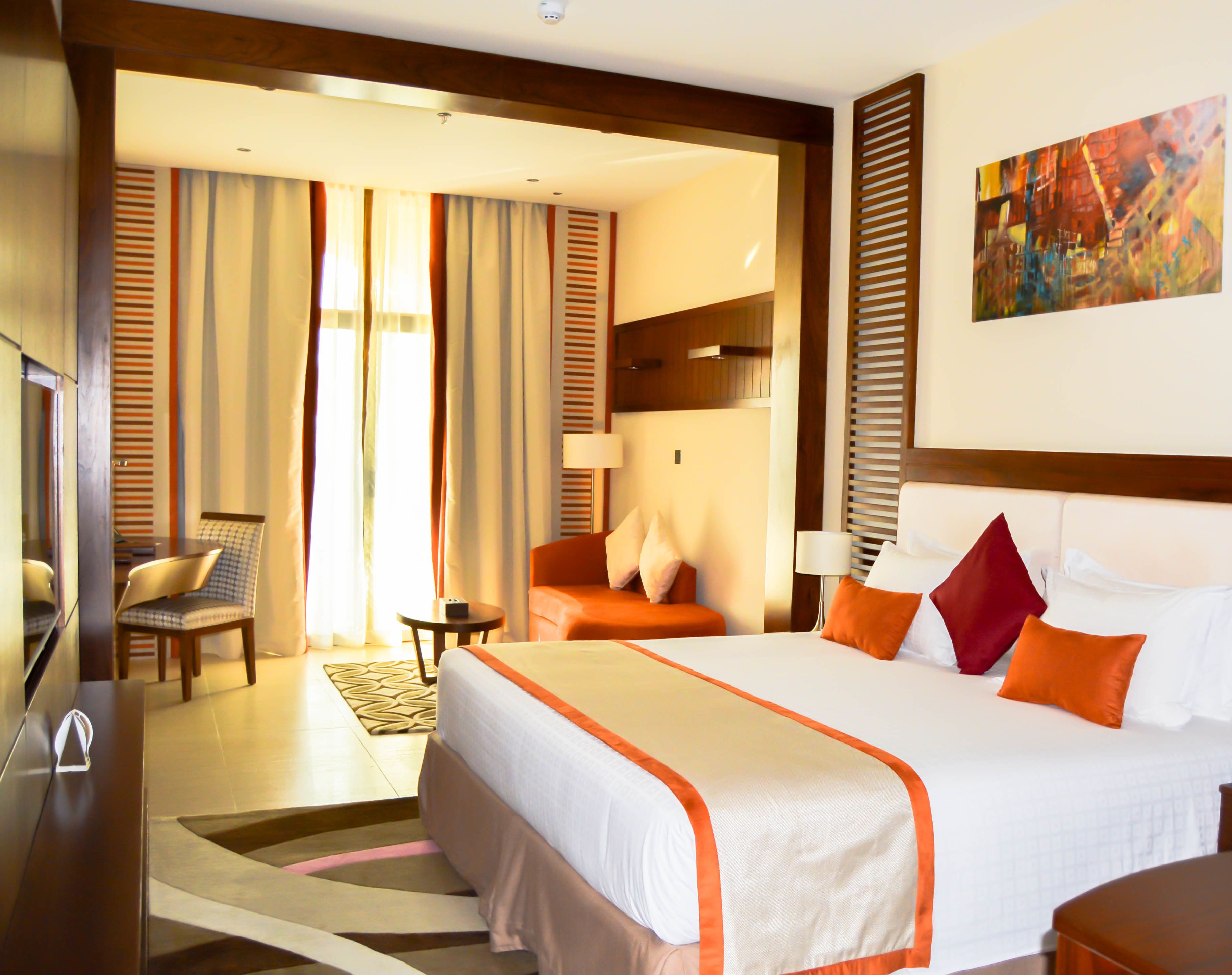 deluxe room | premium bedding, minibar, in-room safe, individually decorated