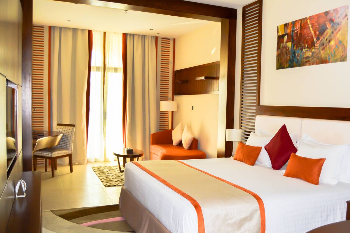 deluxe room | premium bedding, minibar, in-room safe, individually decorated