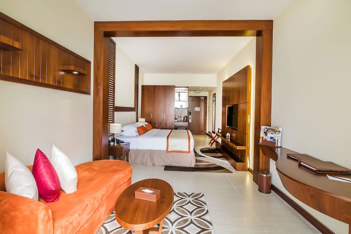 premier room, 1 king bed, pool access, pool view | premium bedding, minibar, in-room safe, individually decorated