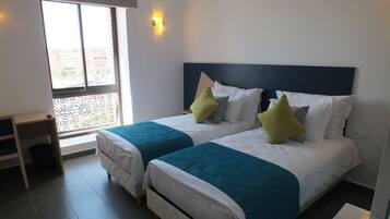 Premium bedding, desk, blackout drapes, soundproofing