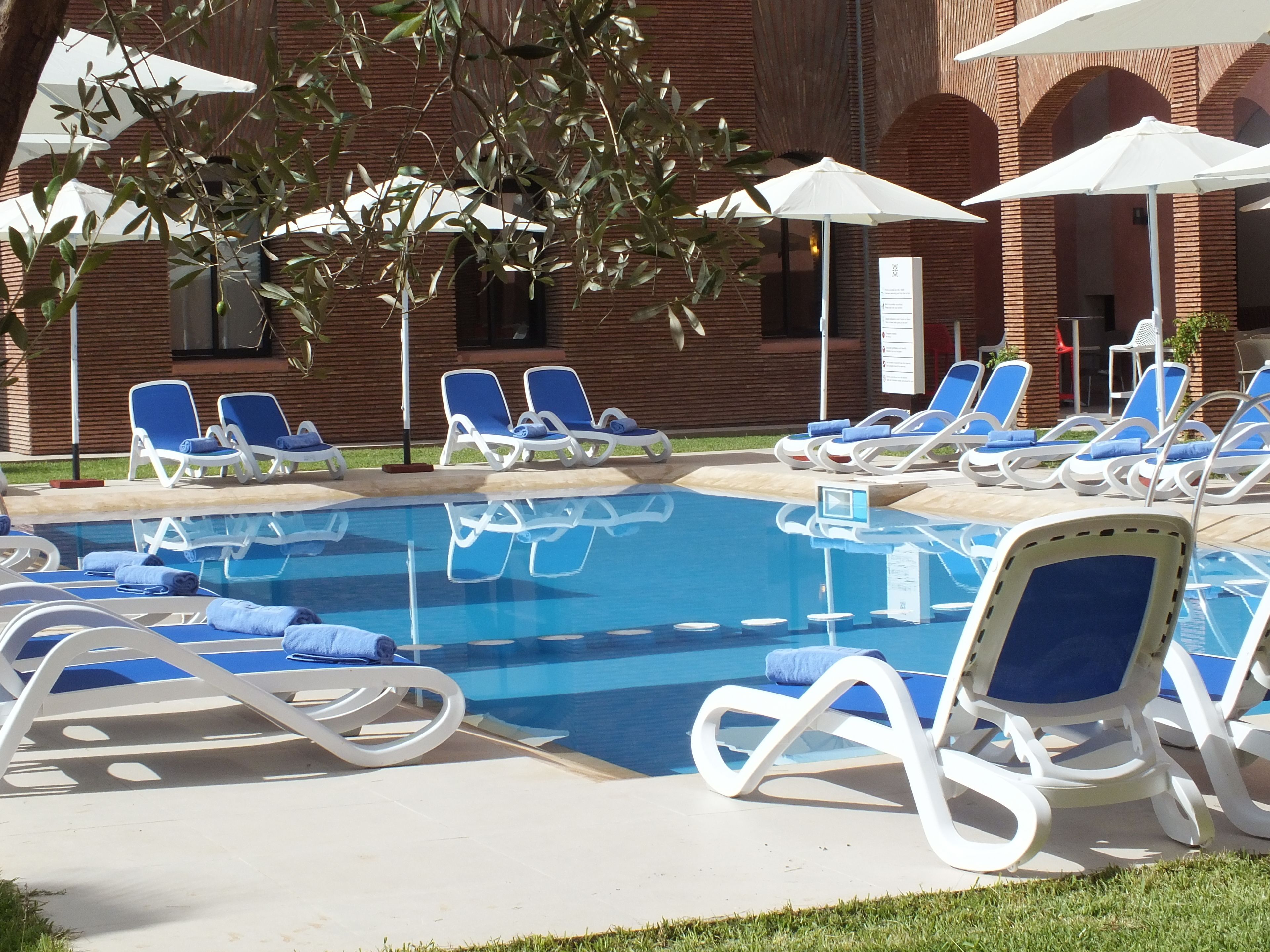 outdoor pool, pool umbrellas, pool loungers
