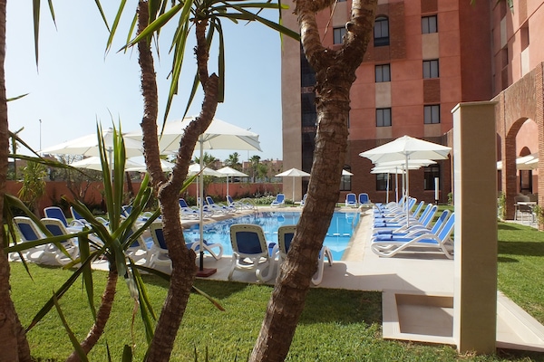 Outdoor pool, pool umbrellas, pool loungers