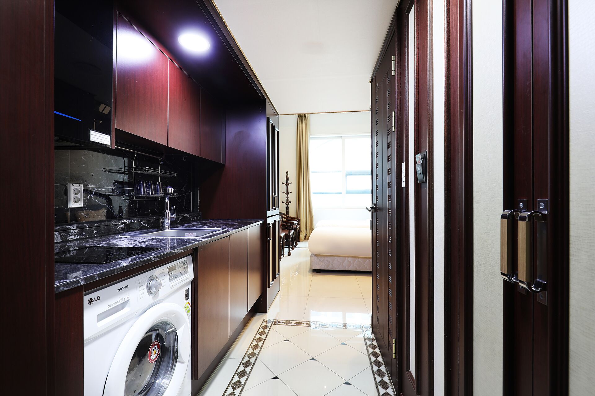 deluxe triple room (with kitchen) | private kitchen | fridge, microwave, stovetop