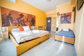 A hotel room with two beds, a wooden headboard, and a large mural on the wall. - Movie Home B&B (Rome)