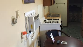 Apartment, 1 Bedroom, Smoking (1 King Bed, 1 Queen Bed, Kitchen) | Living area | 32-inch LED TV with premium channels, TV, DVD player