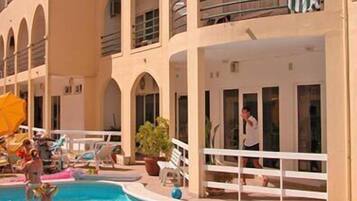 Indoor pool, outdoor pool, pool umbrellas, pool loungers