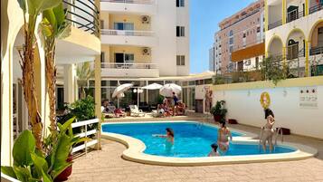 Indoor pool, outdoor pool, pool umbrellas, pool loungers