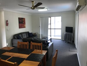 Family Apartment, 3 Bedrooms, Balcony | Living area | 32-inch flat-screen TV with digital channels, TV - Coffs Shearwater Motel (Coffs Harbour)