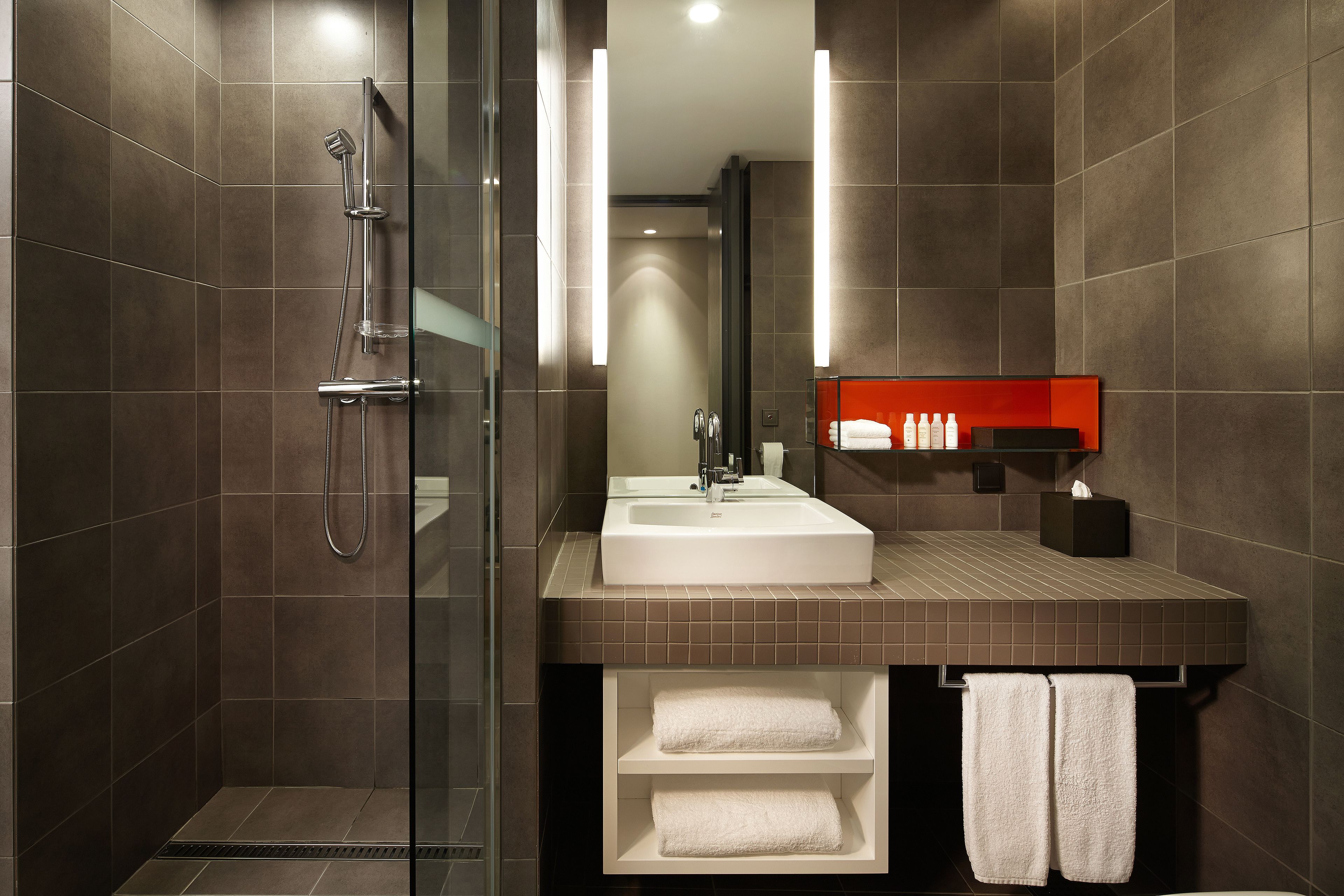 designer toiletries, hair dryer, bathrobes, slippers