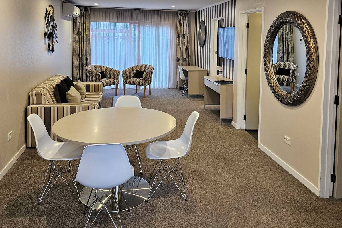 Desk, laptop workspace, blackout curtains, iron/ironing board